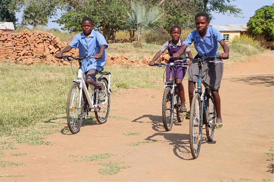 Child beneficiaries of the joint EAA Foundation-World Vision, "Empowering Vulnerable Children with Education (EVE)” project in Zambia, going out for a ride.