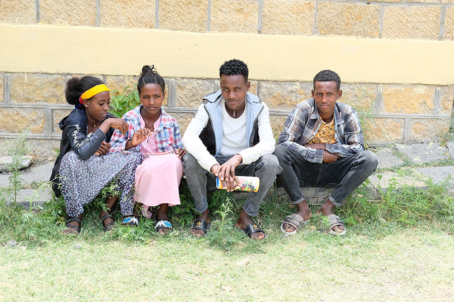 Nigus and his classmates outside his school.