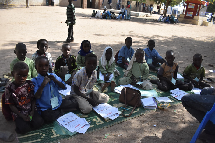 Students in Sudan, working on their projects outdoors.